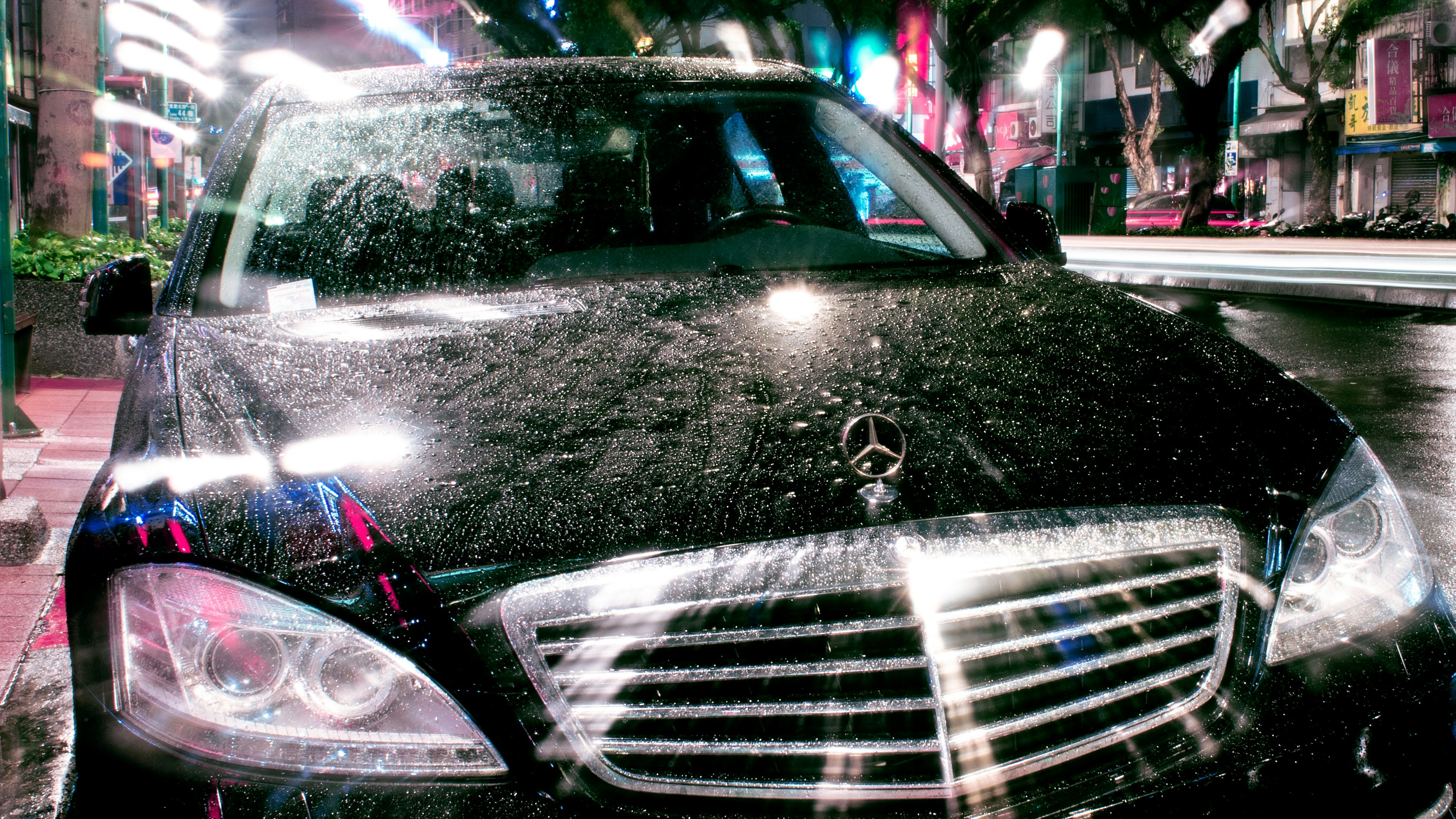 silver mercedes benz car with water droplets