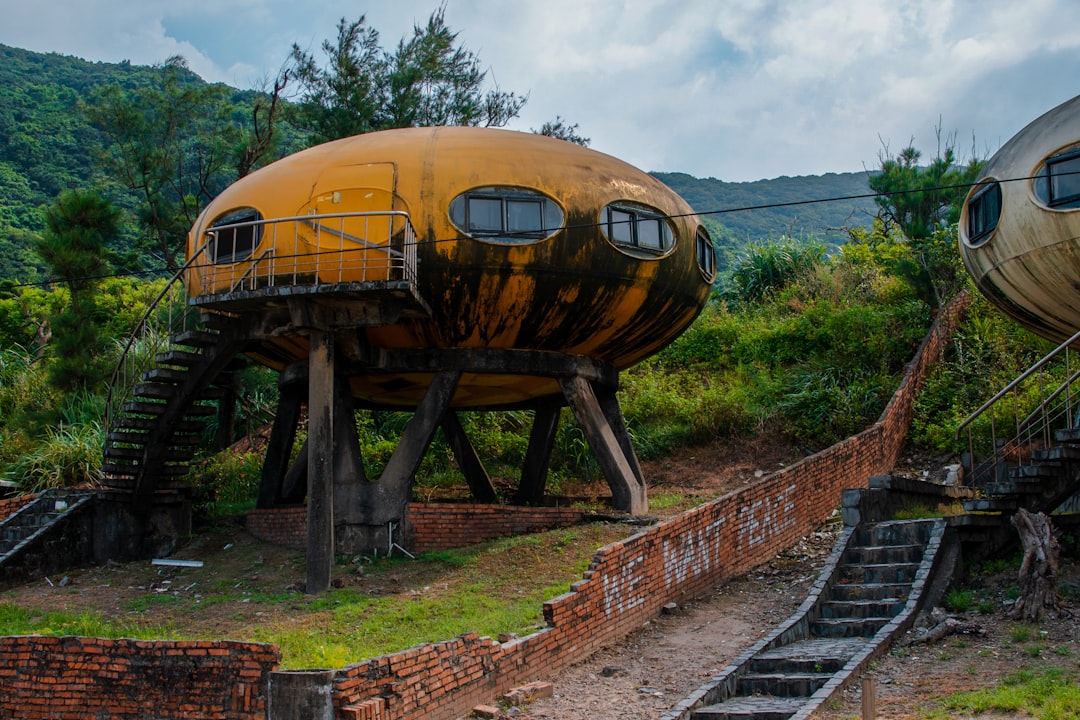 brown and black metal tank on brown wooden rail