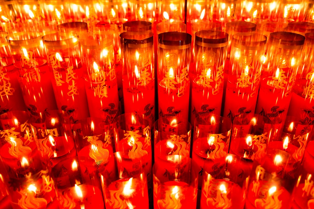 red candles on glass holder