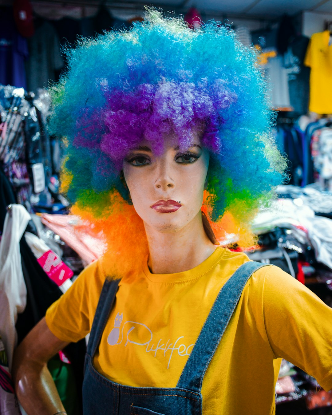woman in purple wig and yellow shirt
