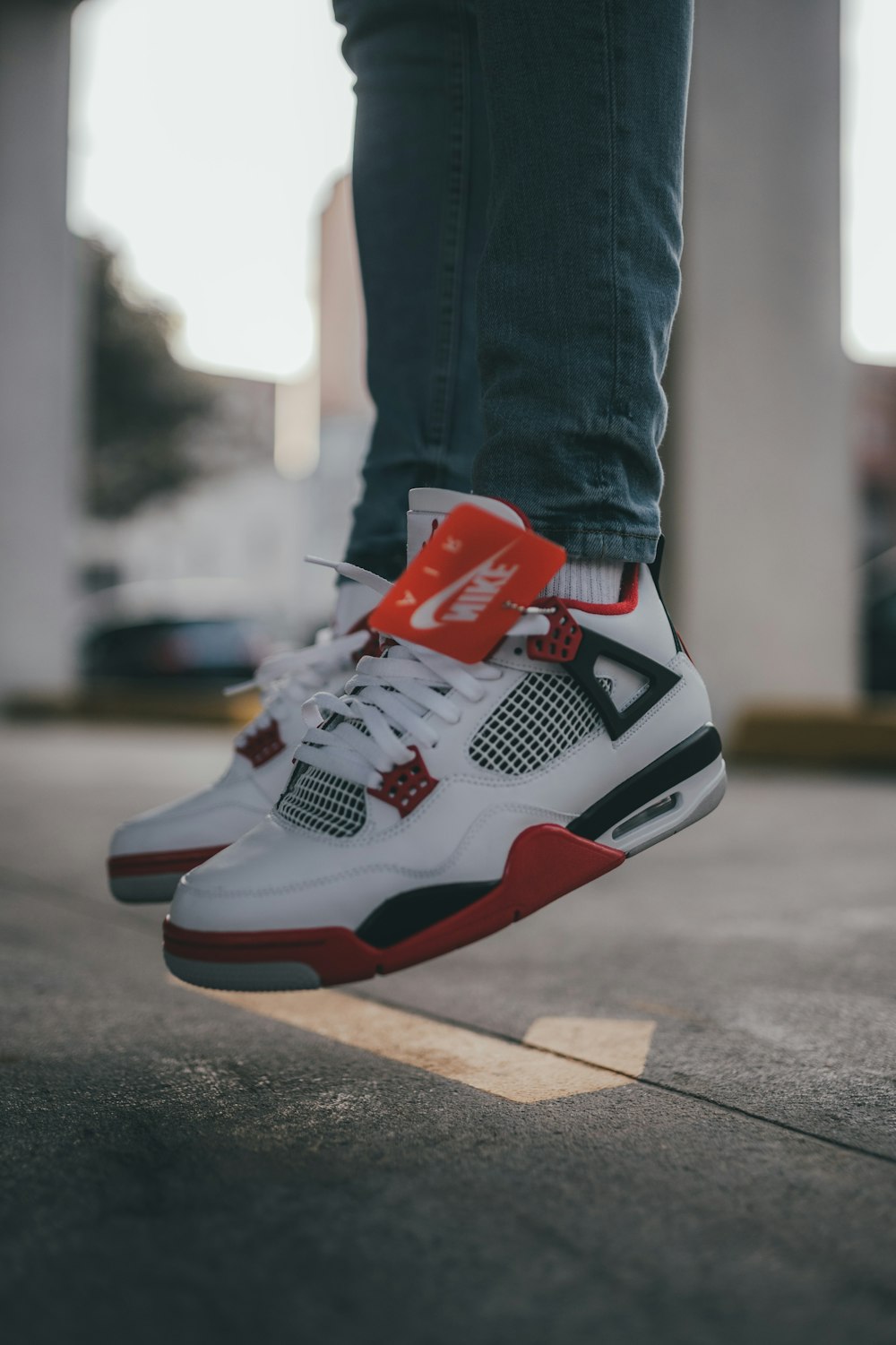 Person in blue denim jeans wearing red and white nike air max 90 photo –  Free Shoe Image on Unsplash