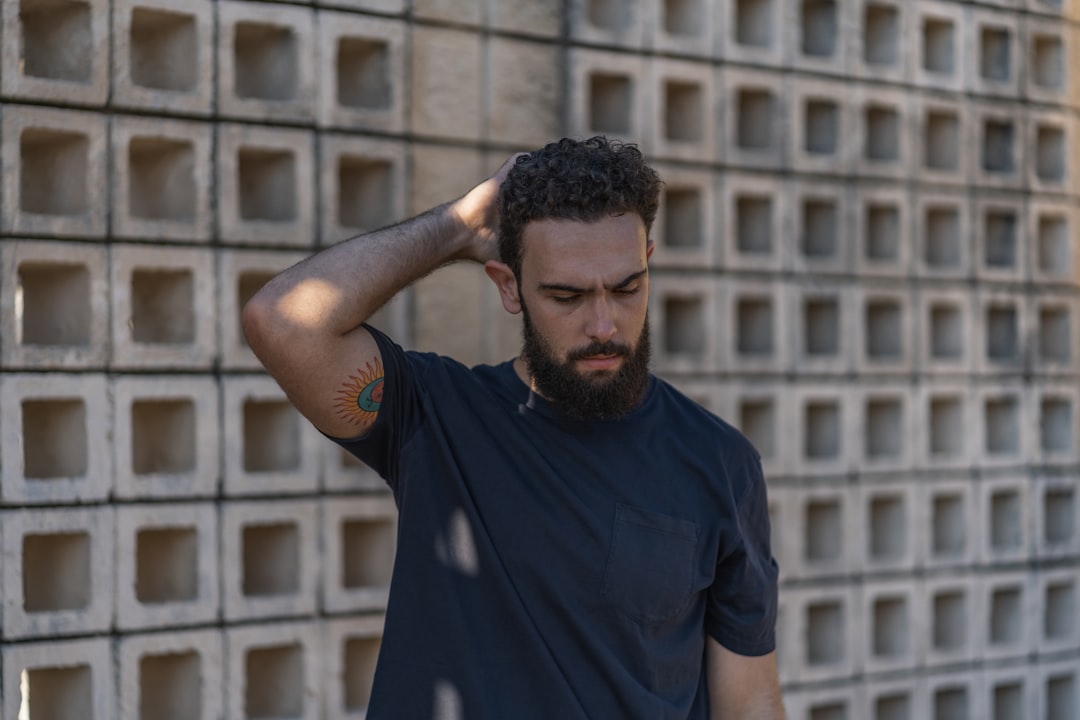 man in blue crew neck t-shirt