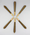 brown and black sticks on white surface