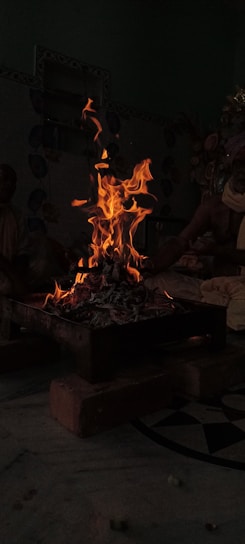 A warm gathering of diverse community members sharing stories around a glowing hearth.