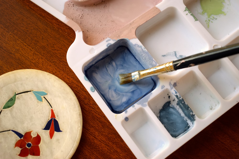 yellow handle knife on white ceramic plate