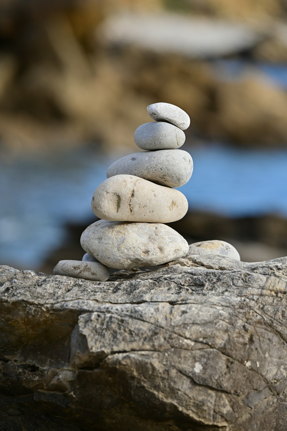 a stack of rocks sitting on top of a rock