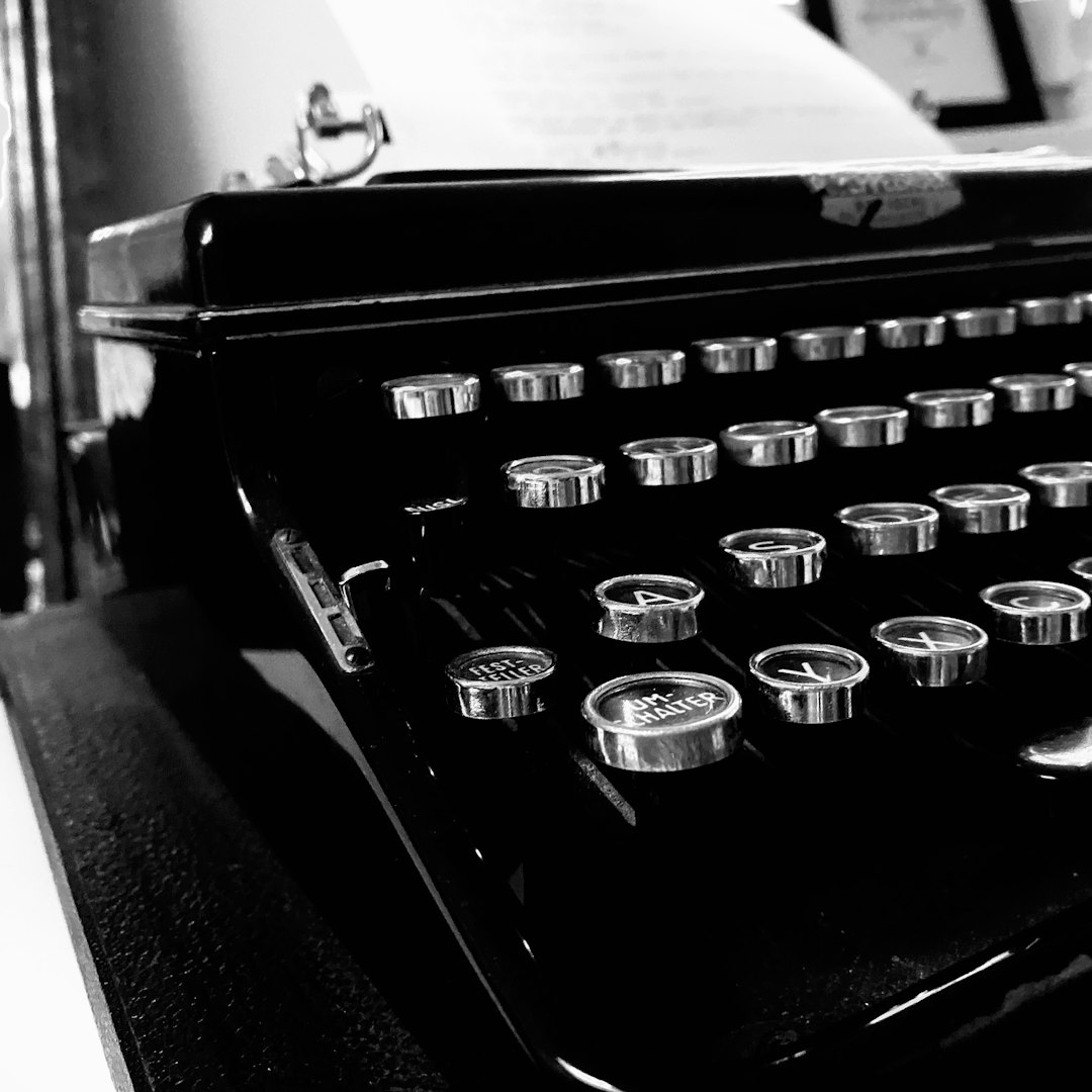 black and silver typewriter on table