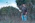 man in black crew neck t-shirt standing on green grass field during daytime