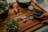green vegetable on brown wooden chopping board