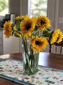 Bright sunflowers arranged in a cheerful bouquet on a wooden table