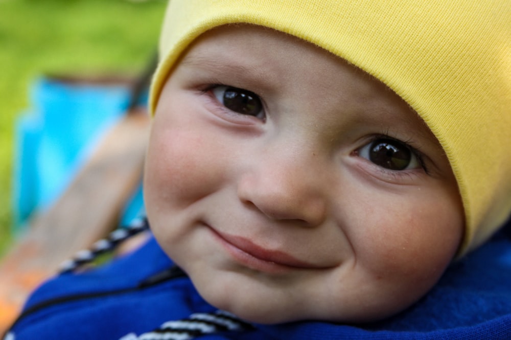 child in yellow knit cap