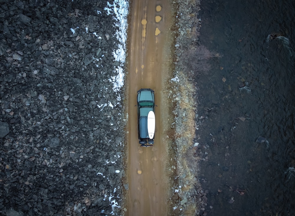 black and white car on brown wooden board