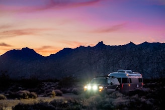 white suv pulling an airstream with a LiFePO4 battery