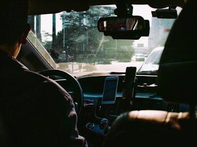 person driving car during daytime