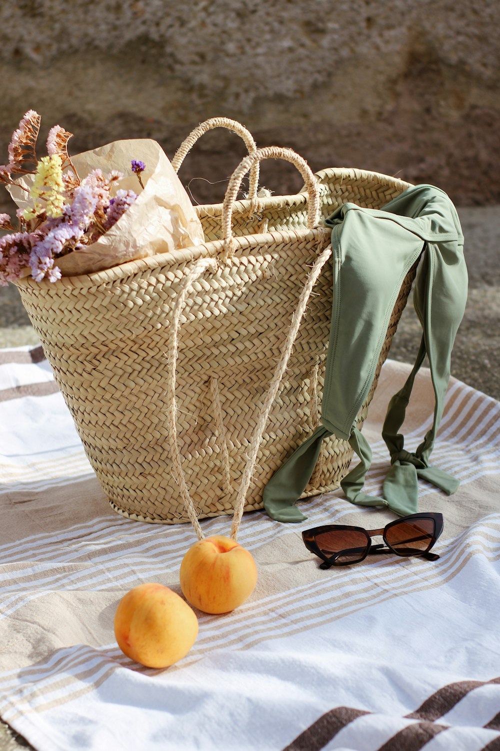 brown woven basket with assorted flowers