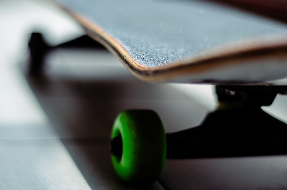 green plastic cup on white table