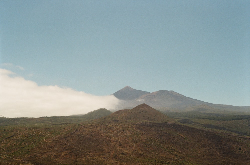 green and brown mountain under blue sky during daytime