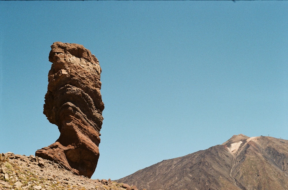 brown rock formation under blue sky during daytime