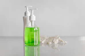white and green pump bottle