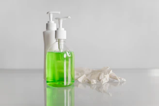 white and green pump bottle