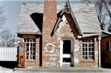brown brick building with white wooden door