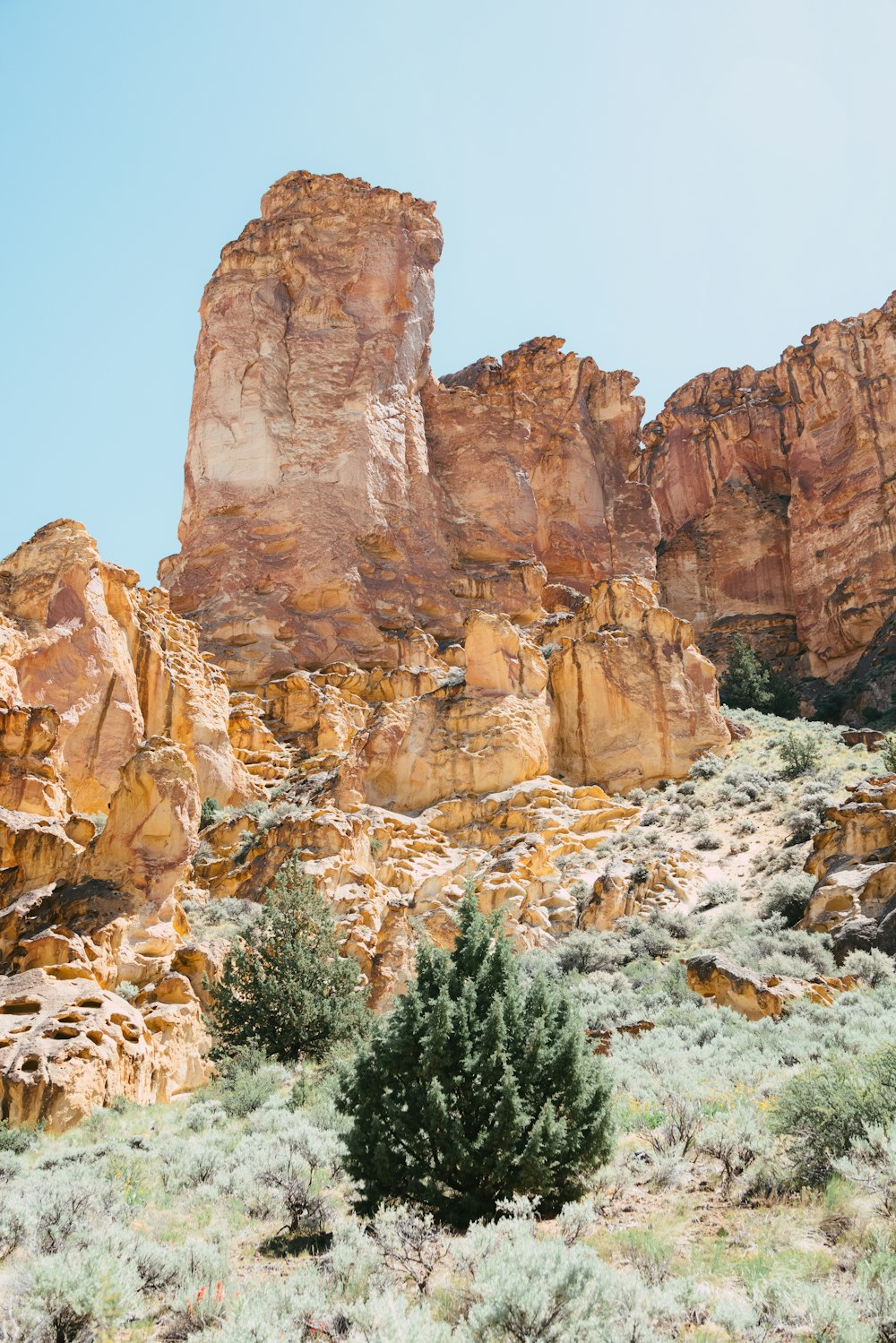 brown rock formation under blue sky during daytime