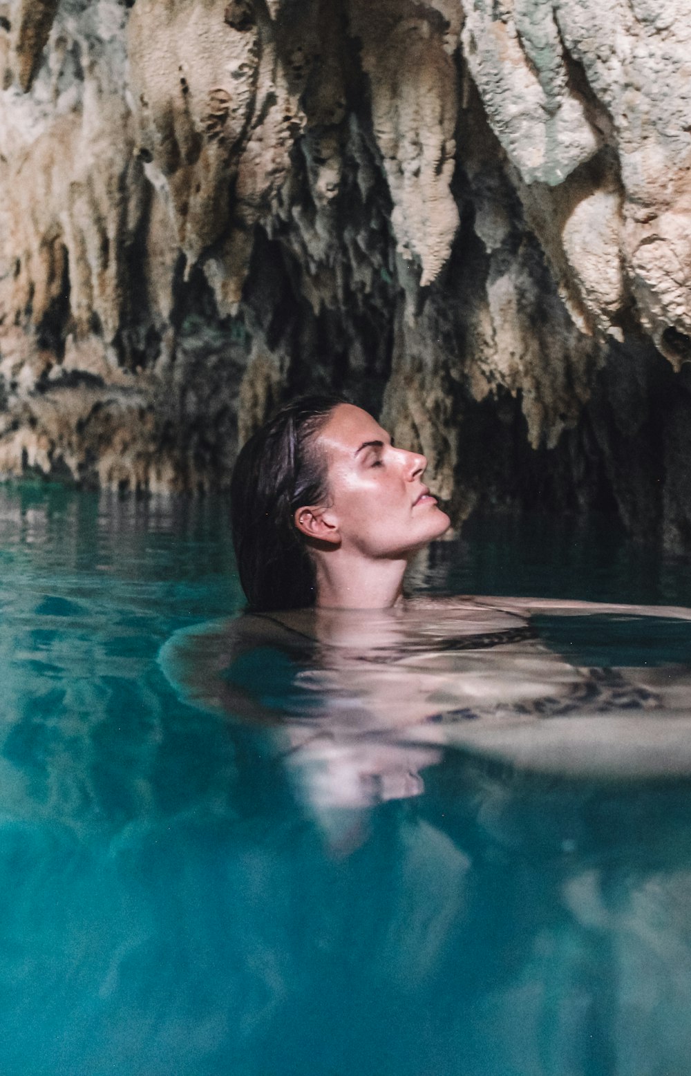 woman in swimming pool during daytime