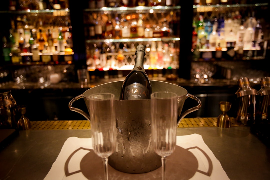 clear glass pitcher on table