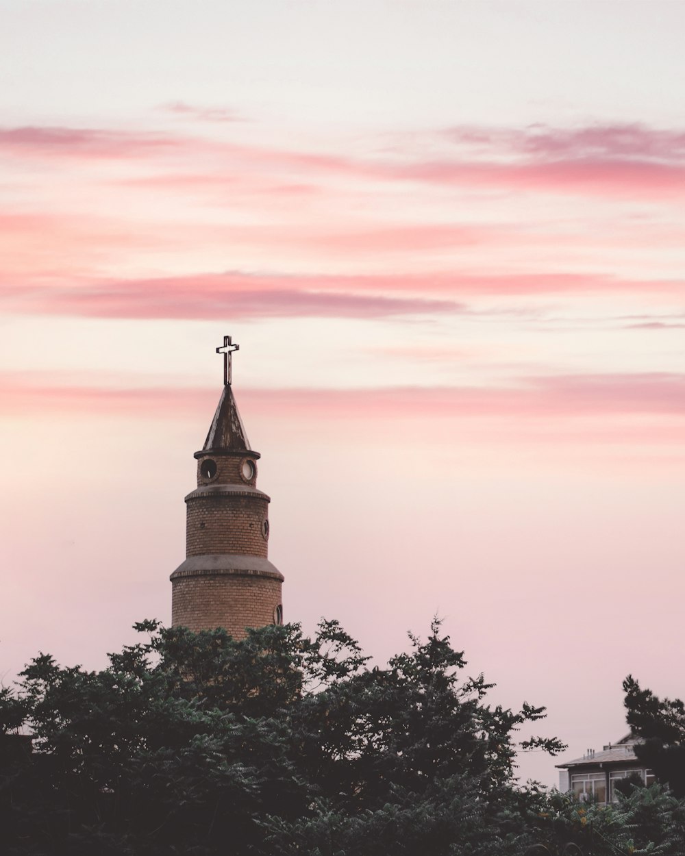 brown concrete tower during sunset