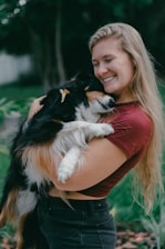A happy dog and owner sharing a relaxed moment outdoors