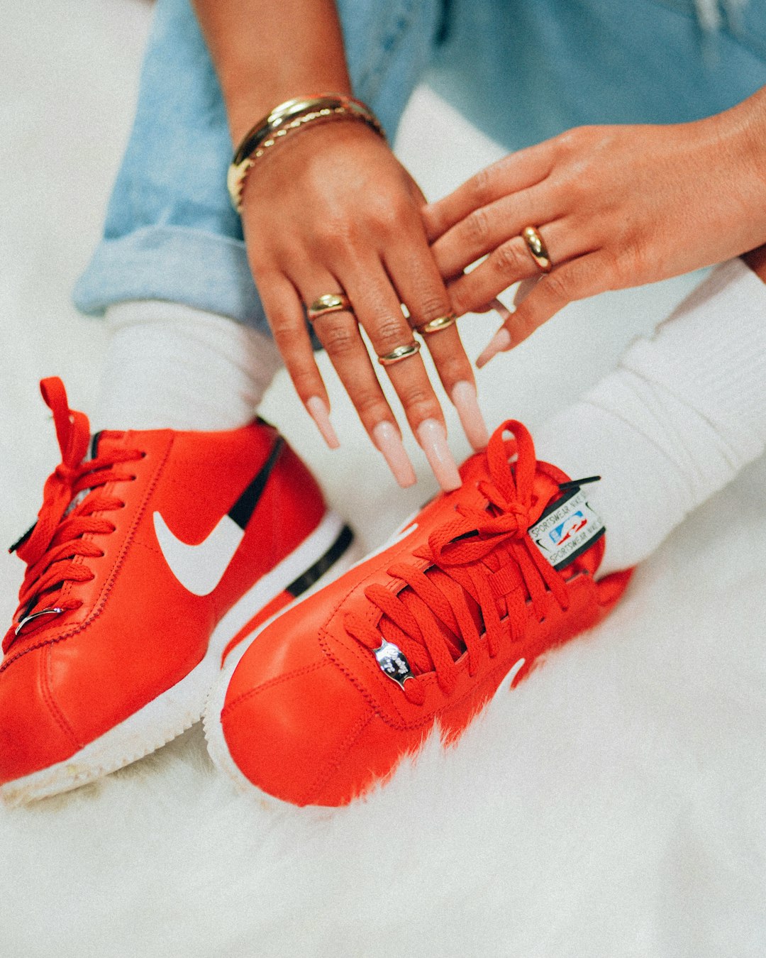 person wearing red nike sneakers