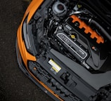 black and orange car engine bay