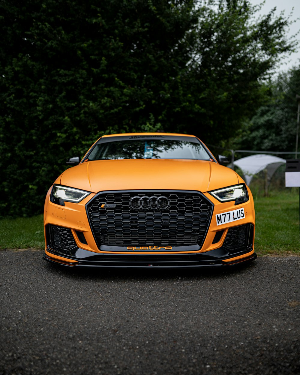 orange audi car on road during daytime