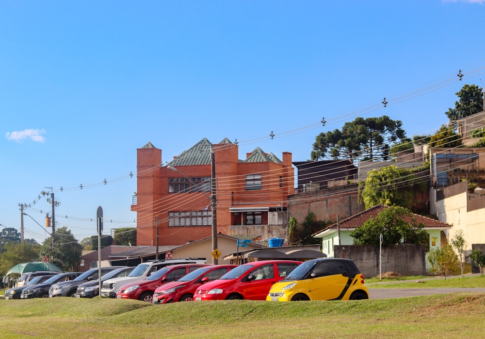 cars parked on parking lot near brown building during daytime