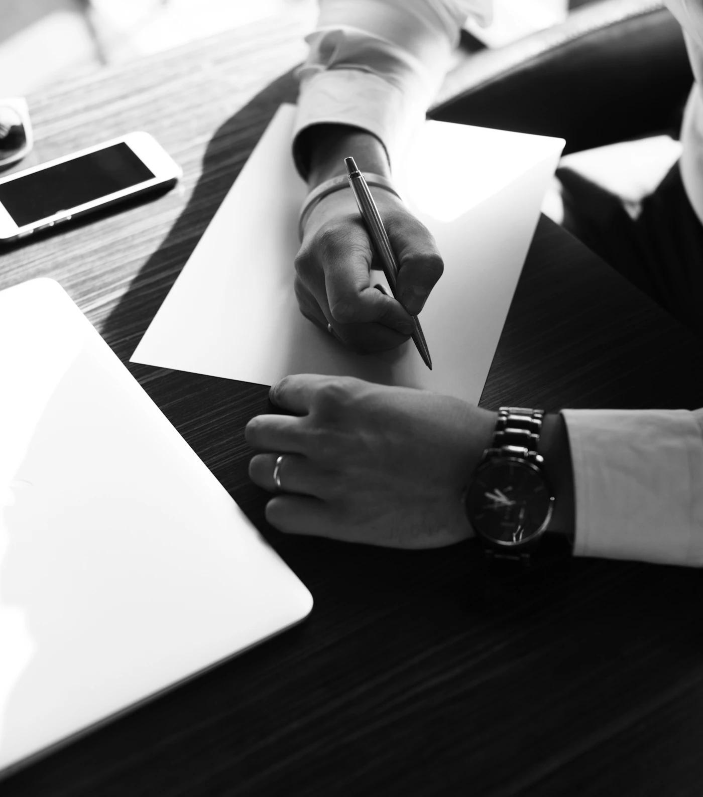 Documents being signed on a desk