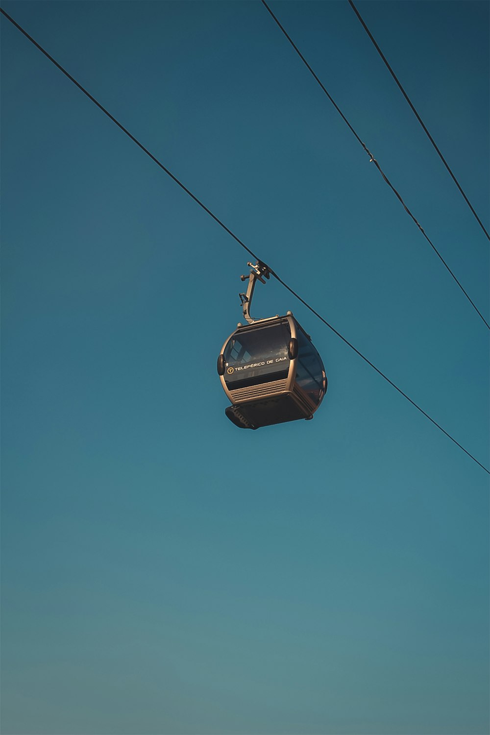 black cable car under blue sky