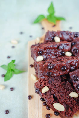 Artfully arranged cake slices on a wooden board, highlighting texture and rich colors.