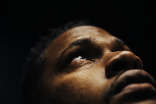 Still frame from a documentary featuring intimate, natural lighting on a subject sharing their story.