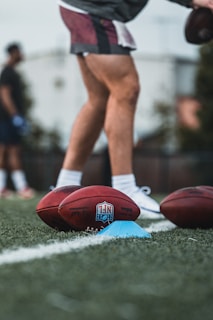 brown and white basketball on green grass field during daytime