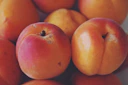 red apple fruit on brown wooden table