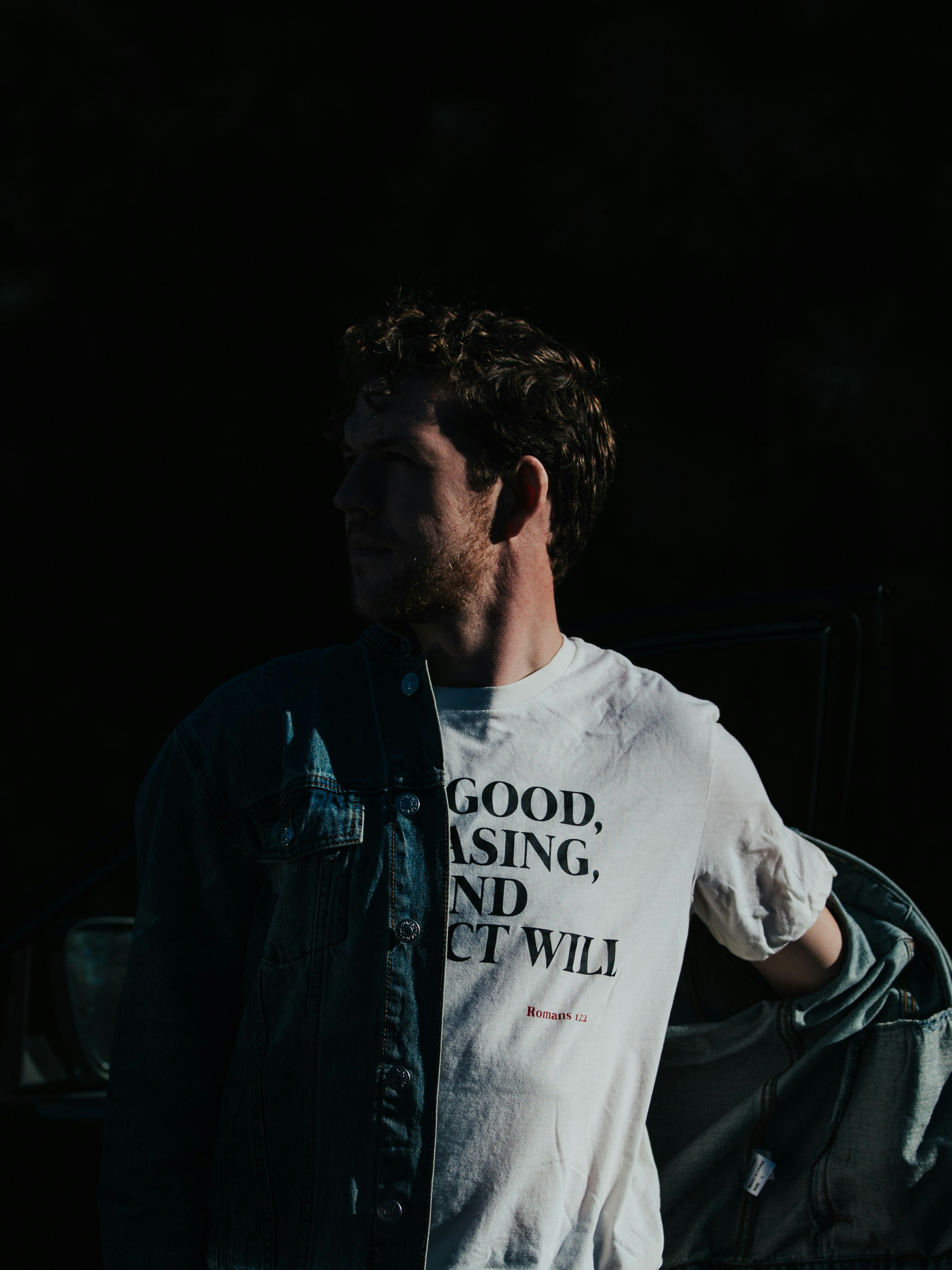 man in white crew neck t-shirt and blue denim jacket