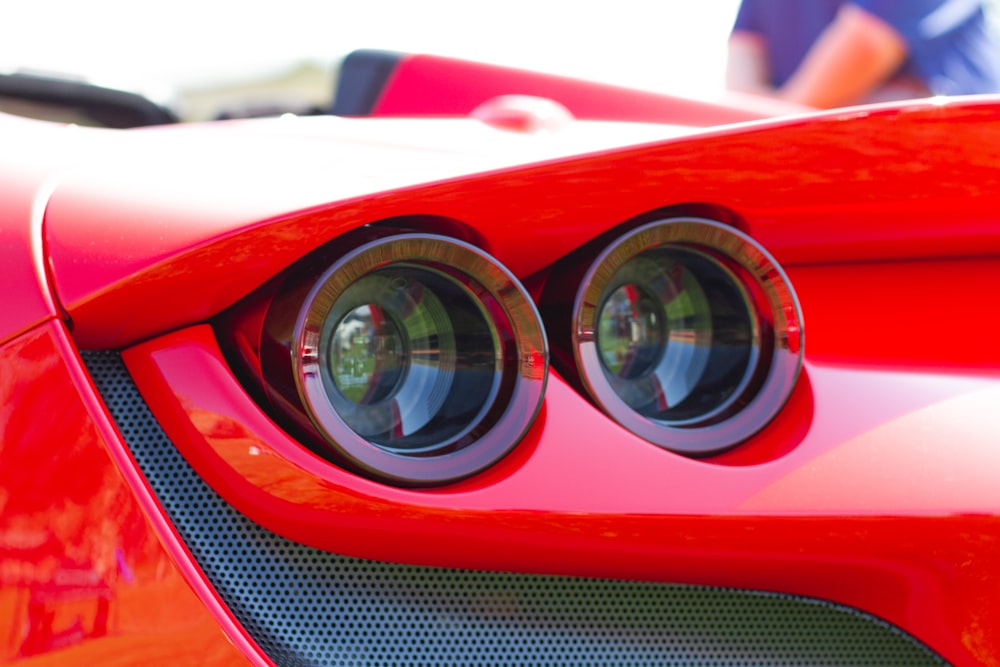 red car in close up photography