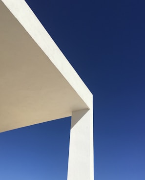 white concrete building under blue sky during daytime