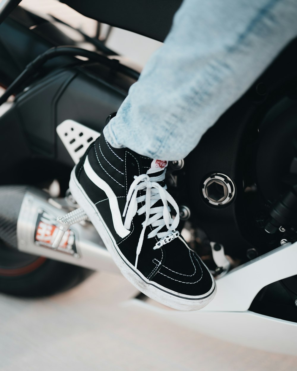 person in blue denim jeans and black and white nike sneakers photo – Free  Image on Unsplash
