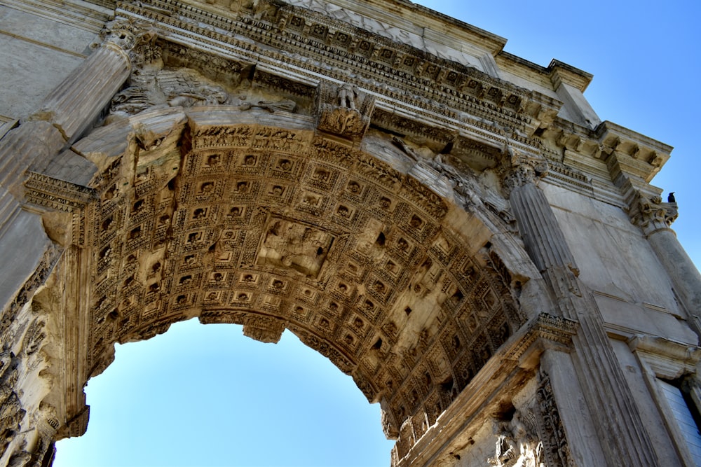 low angle photography of arc de triomphe