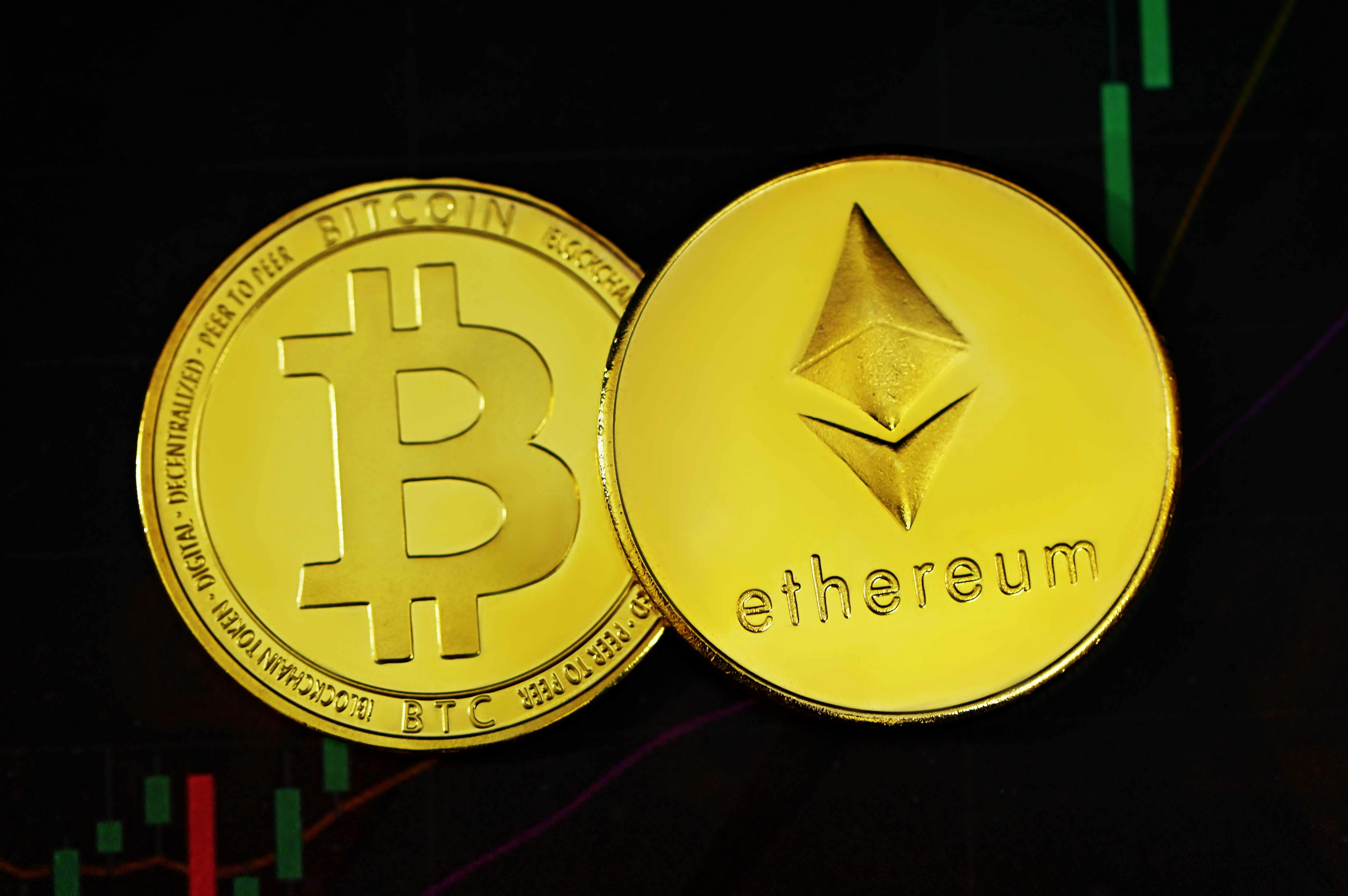Bitcoin and Ethereum coin on top of trading background