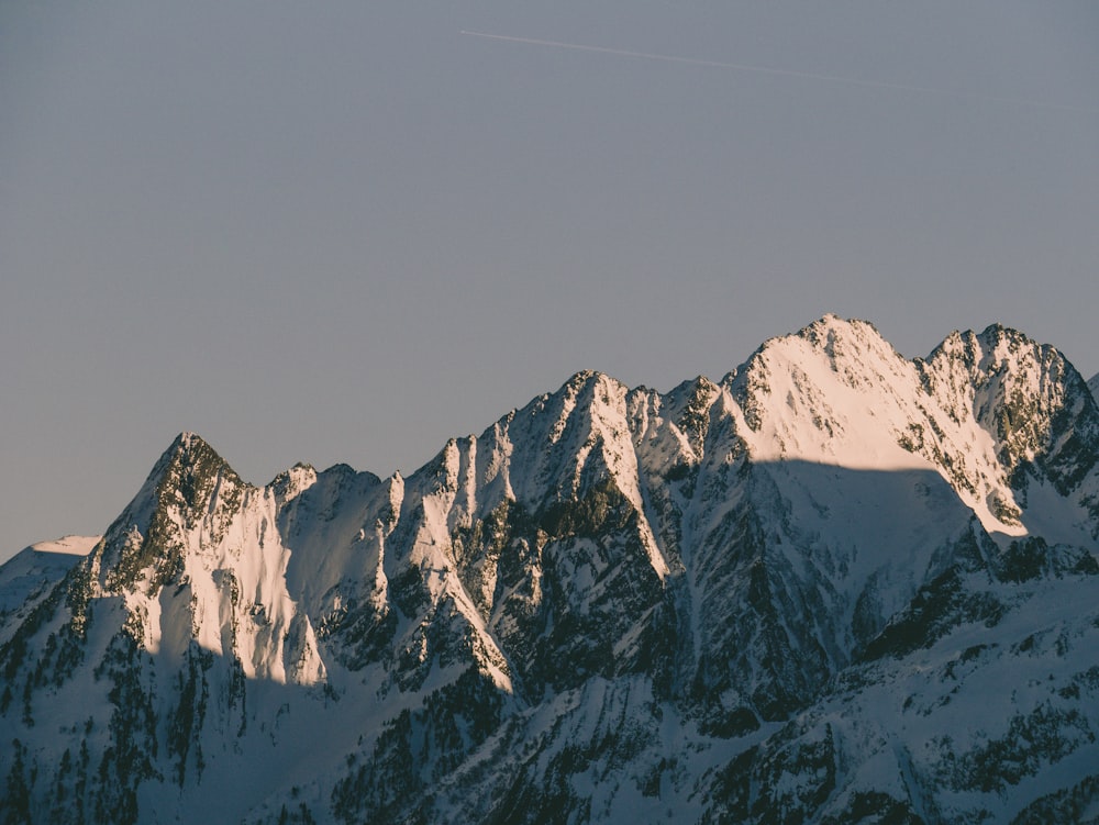 snow covered mountain under blue sky during daytime