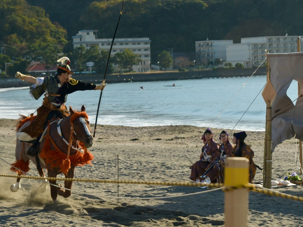 people riding horses on beach during daytime