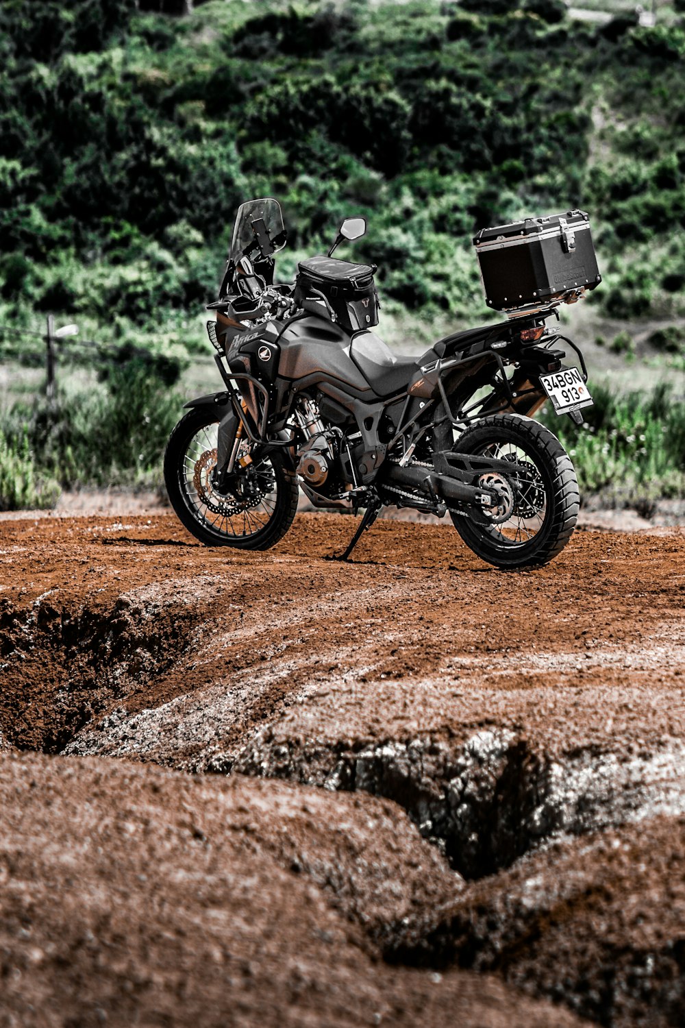 black and gray motorcycle on brown dirt road during daytime