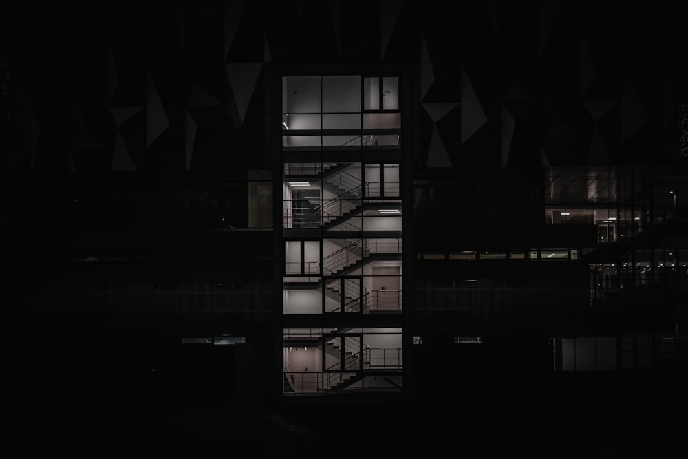 black and white building during night time